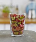 Glass of sliced rhubarb — Stock Photo