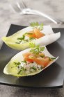 Chicory boats with salmon — Stock Photo