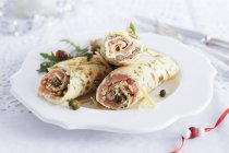 Crepes filled with salmon — Stock Photo