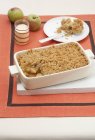 Closeup view of apple Crumble with cream and apples — Stock Photo