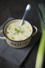 Cheese soup with leek in bowl — Stock Photo