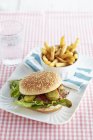 Mackerel burger with chips — Stock Photo