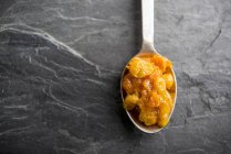 Spoonful of apricot chutney — Stock Photo