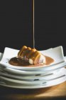 Caramel sauce on plates — Stock Photo
