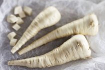 Fresh whole and diced Parsnips — Stock Photo