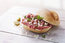 Roll with raw minced meat — Stock Photo