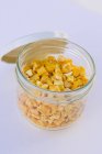 Closeup view of freeze dried mango pieces in jar — Stock Photo