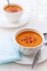 Carrot soup in white bowl — Stock Photo