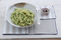 Large fusilli pasta with herb sauce — Stock Photo
