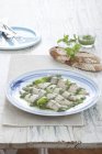 Mackerel with pesto on plate — Stock Photo