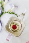 Tea flower in glass teapot — Stock Photo