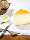 Gouda cheese on paper — Stock Photo