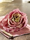 Radicchio chioggia on a place mat on wooden surface — Stock Photo
