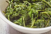 Kale leaves sauted in olive oil — Stock Photo