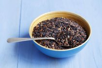 Bowl of black wholemeal rice — Stock Photo