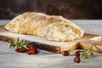 Ciabatta bread on board — Stock Photo