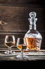 Glasses of cognac and a carafe — Stock Photo