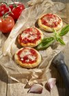 Pizzas with tomato sauce — Stock Photo