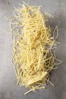 Dry uncooked Egg noodles — Stock Photo