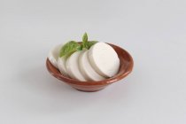 Vegan mozzarella in terracotta bowl — Stock Photo