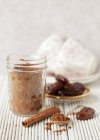 Closeup view of cocoa powder with dates and cinnamon — Stock Photo