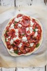 Unbaked pizza with tomatoes — Stock Photo