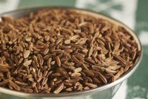 Caraway seeds in metal bowl — Stock Photo