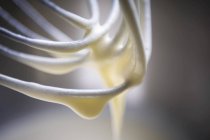 Whipped batter on a whisk — Stock Photo