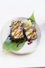 Futo maki com lagostim e abacate em prato branco — Fotografia de Stock