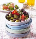 Spicy olives with peppers — Stock Photo
