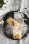 Spelt crepes with icing sugar — Stock Photo