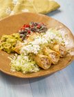 Taquitos with chicken on plate — Stock Photo