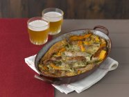 Closeup view of Toad in the hole with butternut squash in a rustic pan — Stock Photo