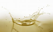 Closeup view of a splash of yellow oil — Stock Photo