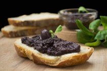 Olive paste on bread — Stock Photo