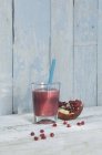 Smoothie in glass with straw — Stock Photo