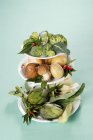 Vegetables and mushrooms on a cake stand — Stock Photo