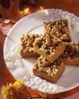 Closeup view of walnut and pecan squares on plate — Stock Photo