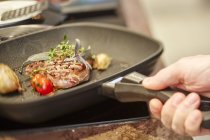 Rump steak in grill pan — Stock Photo
