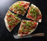 Bruschetta pizza with knife — Stock Photo