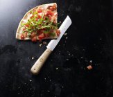 Slice of bruschetta pizza — Stock Photo