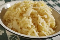 Heap of Sauerkraut in white bowl — Stock Photo