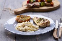 Grilled chicken breast with potato salad — Stock Photo