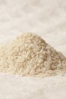 Pile of white uncooked rice — Stock Photo