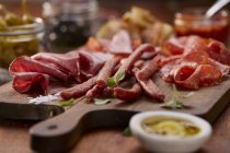 Cold cuts platter with pastrami and salami — Stock Photo