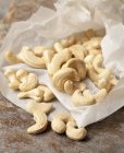 Closeup view of cashew nuts on paper — Stock Photo