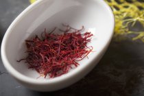 Bowl of saffron threads — Stock Photo