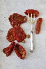 Dried tomatoes with capers — Stock Photo