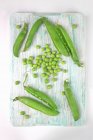 Fresh green Peas and pods — Stock Photo