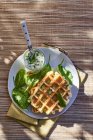 Waffles with courgettes and spinach — Stock Photo